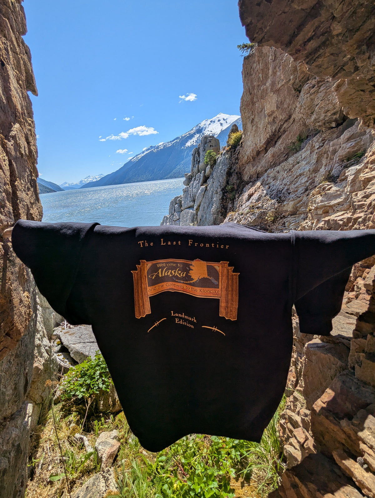 Welcome to Alaska Sign Hoodie — Bring Skagway's Signature Landmark Home.