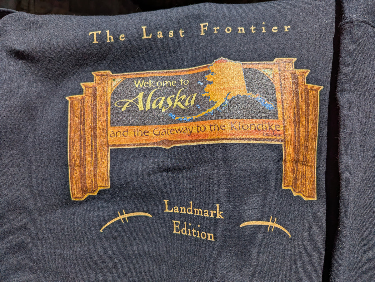 Welcome to Alaska Sign Hoodie — Bring Skagway's Signature Landmark Home.